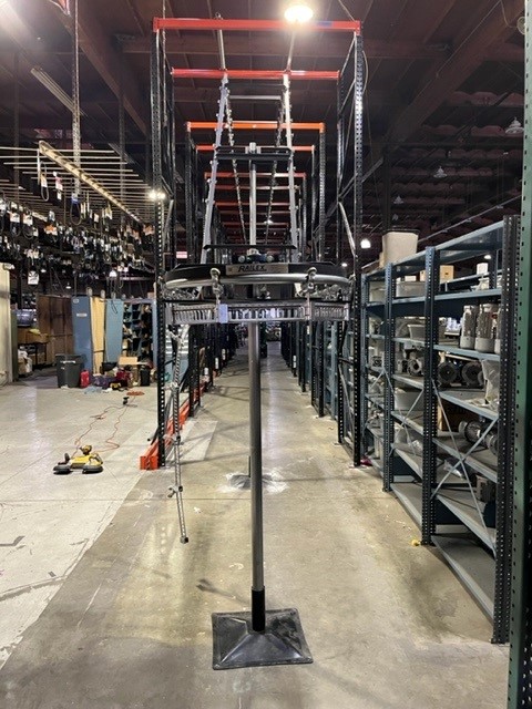 Railex System Conveyor Being Installed In Pallet Rack For Overhead