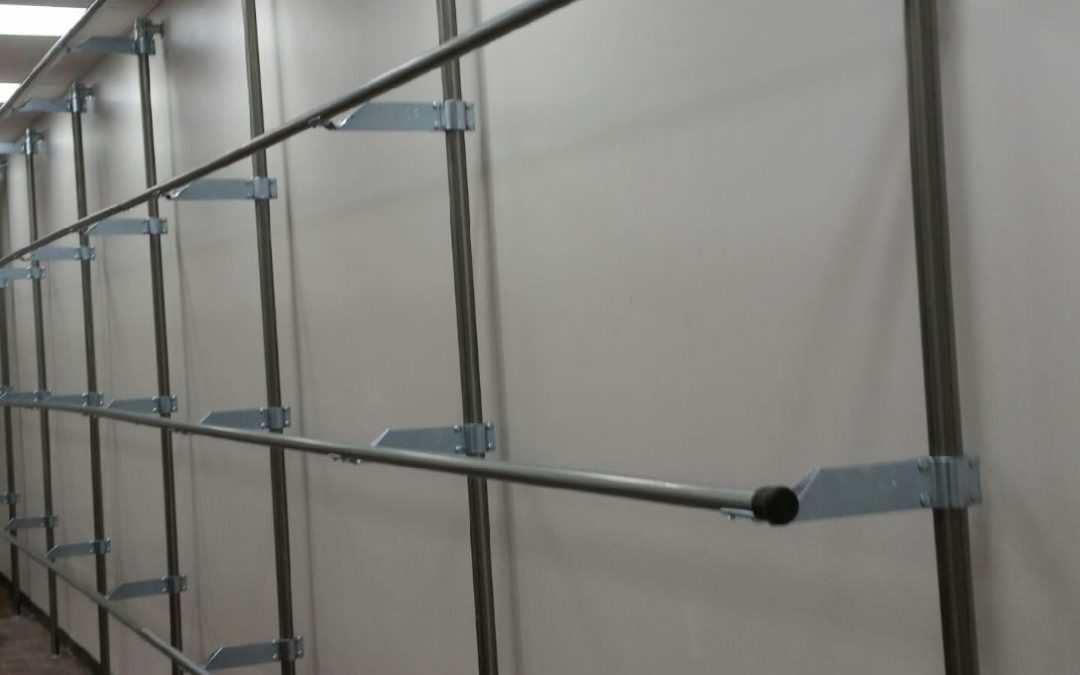 Railex System 200 Slick Rail Garment Rack 4-Tier Single-Sided Against a Wall