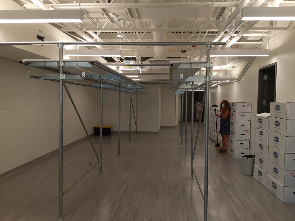 Railex System 200 installed for costume storage in a tight space. We included a shelving system on top for folded items. This system is completely free standing with our end-frame and header design.